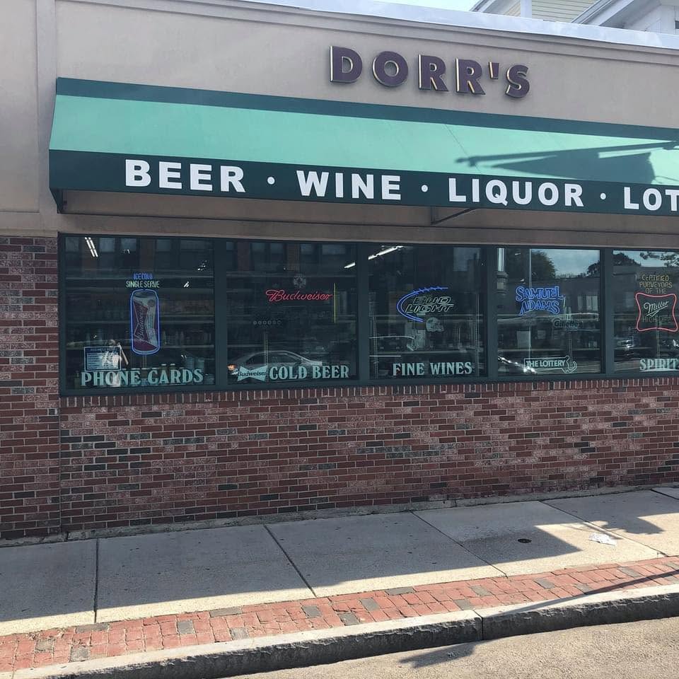 Dorr’s storefront with its green Beer, Wine and Liquor awning and brick facade on Washington Street.